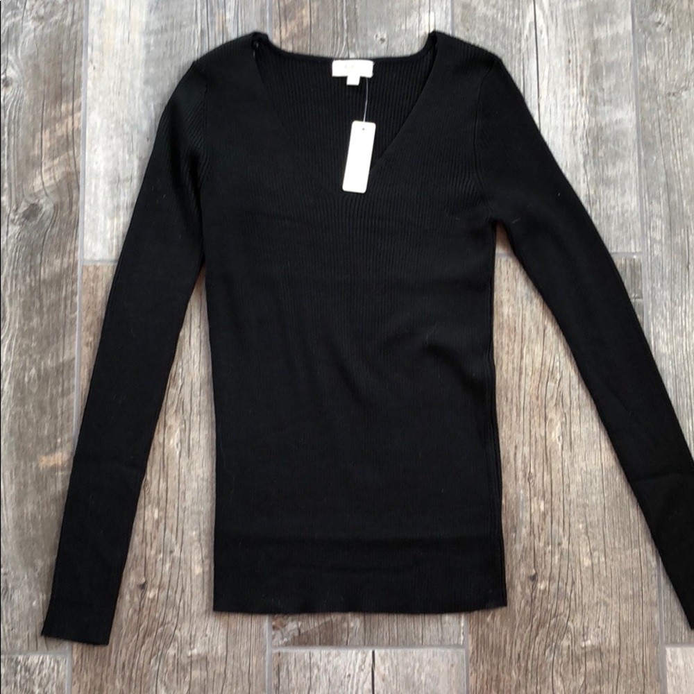 Black v neck sweater. Never worn.